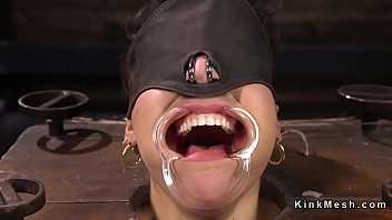 Gagged brunette slave anal hooked till bare feet tormented